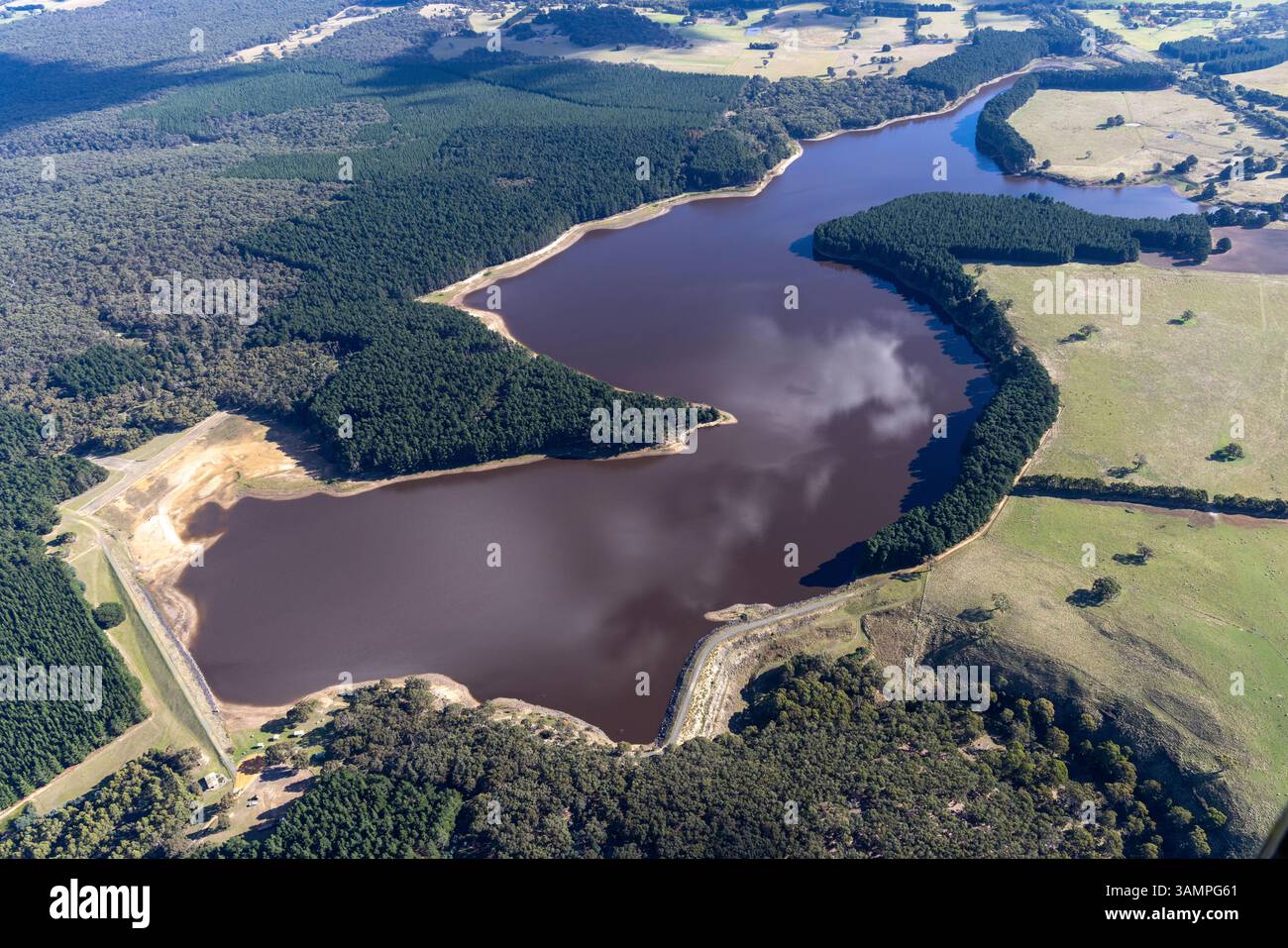 Aerial view of bostock reservoir surrounded by lush greenery and serene ...