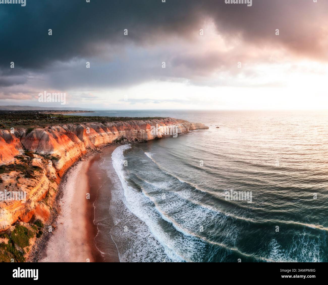 Aerial view of Maslin Beach with rugged cliffs and dramatic clouds at ...