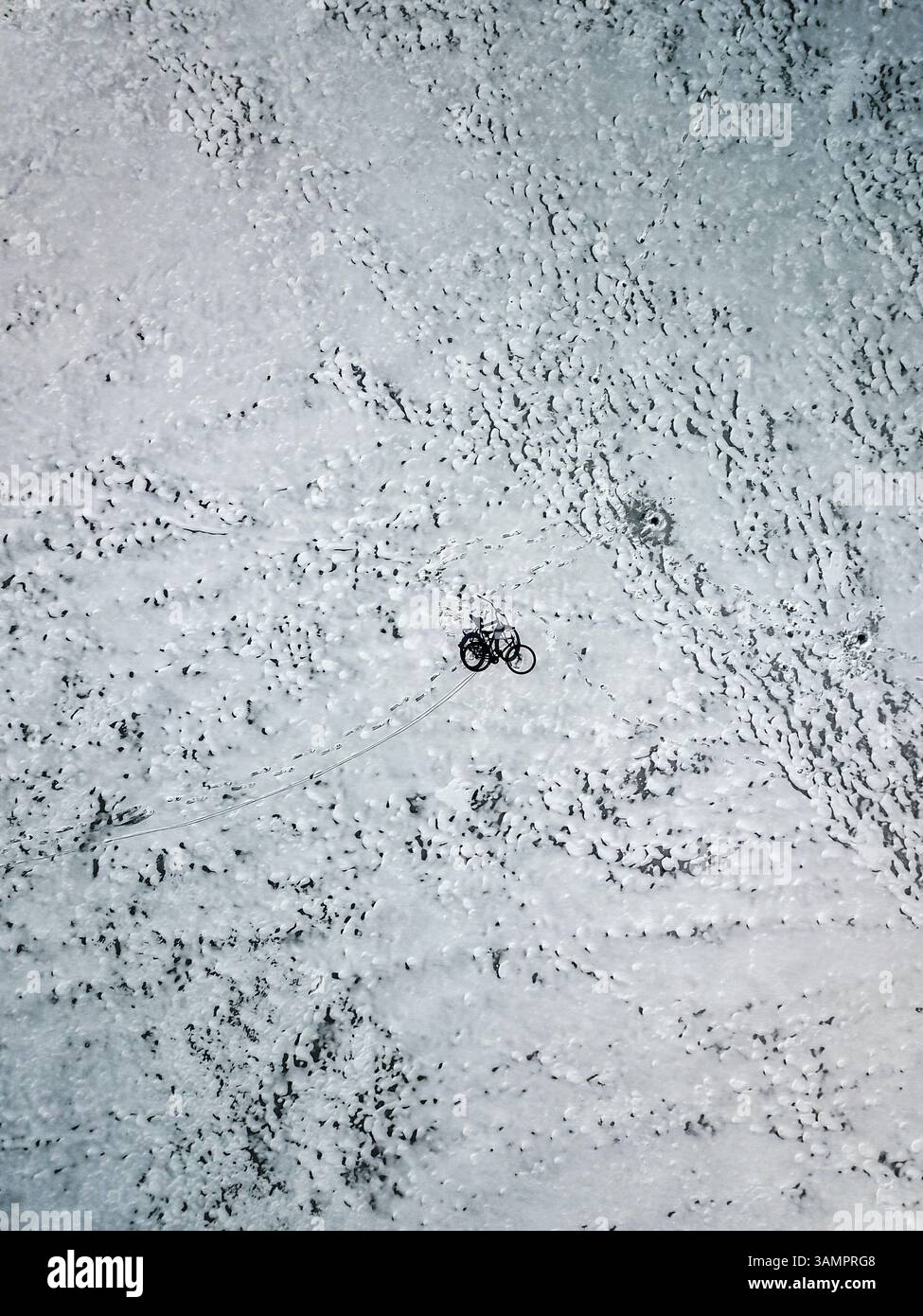 Aerial view of bicycle on frozen lake in Joniskis, Lithuania. Stock Photo