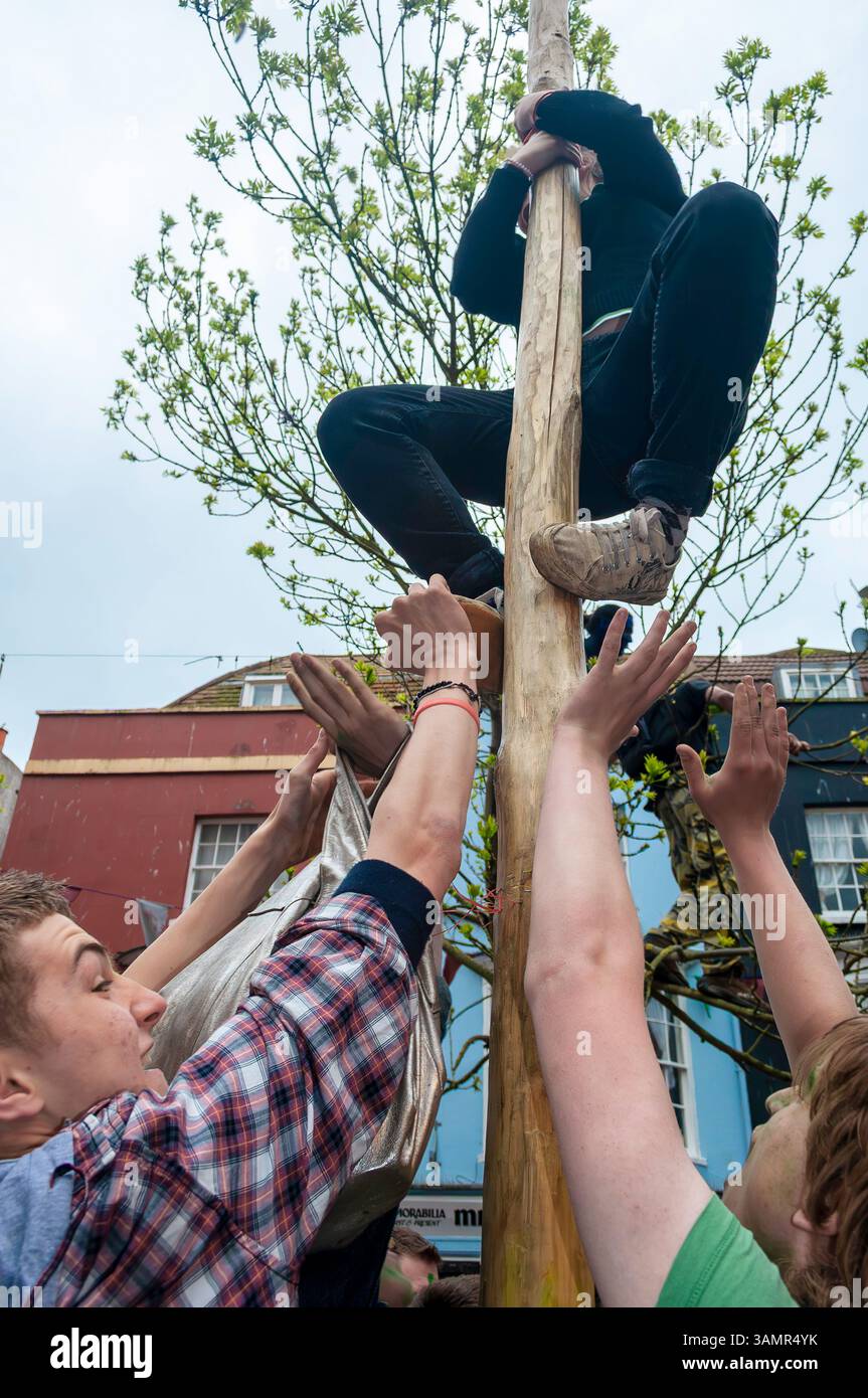 Maypole Climbing Person Climbing the Maypole at Hastings Traditional Jack in the Green ...