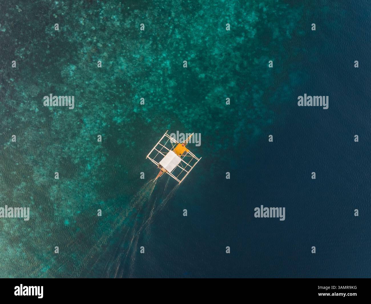Aerial view of single filipino fishing boat near Lapu-Lapu city ...