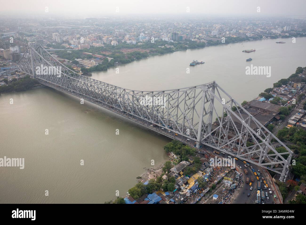 Aerial View Of The Iconic Howrah Bridge Spanning The River With A 