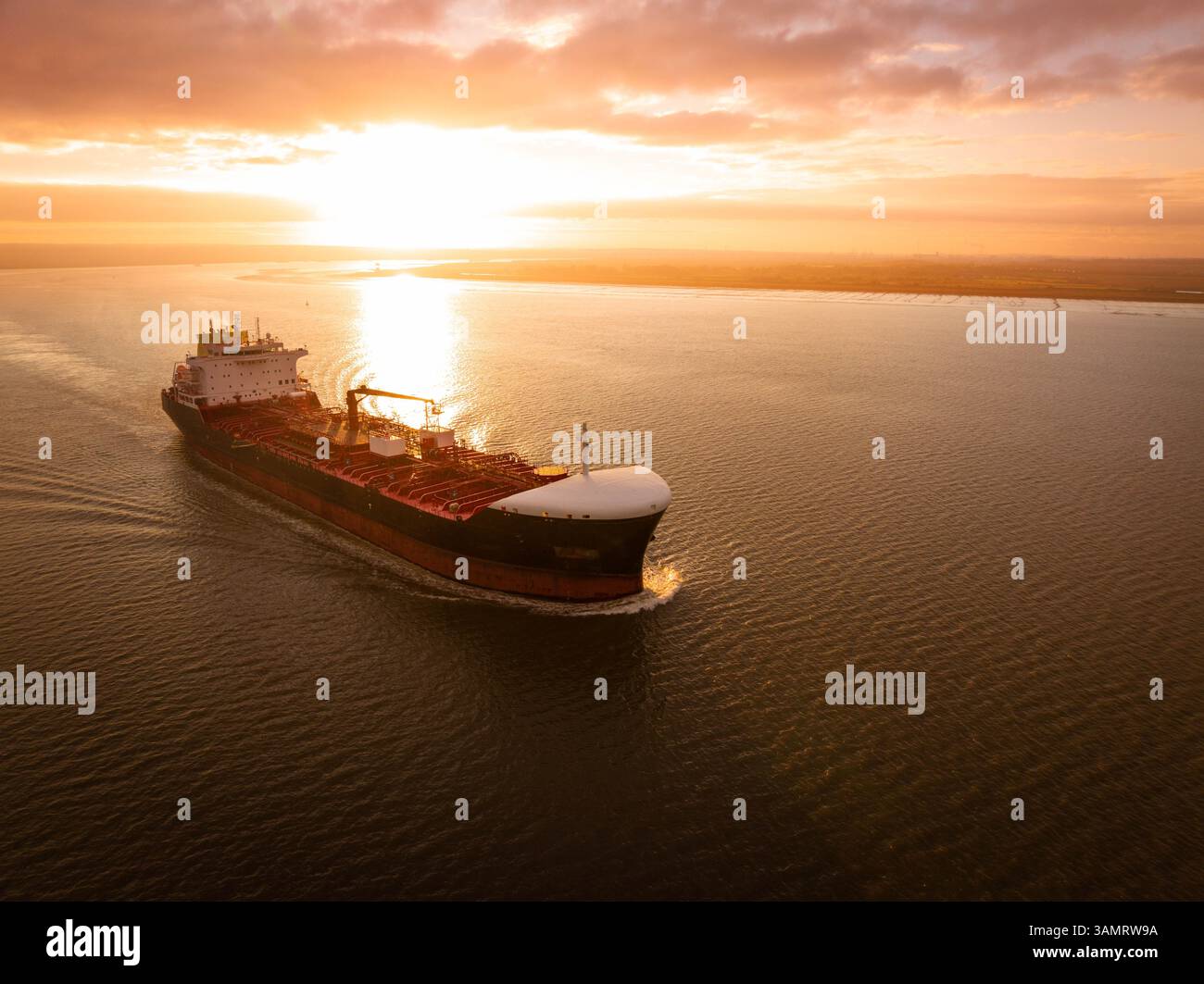 A commercial ship at sunset Stock Photo