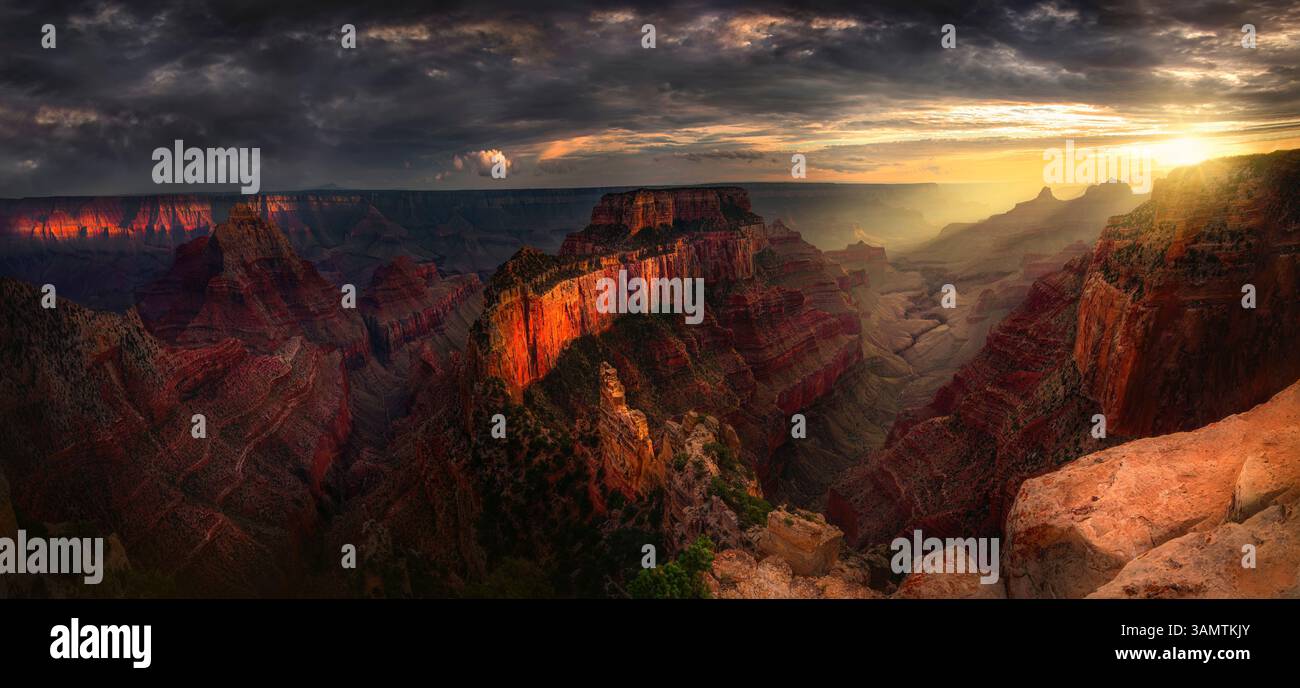Aerial view of Grand Canyon at sunset with dramatic sky and red rocks, Arizona, United States. Stock Photo
