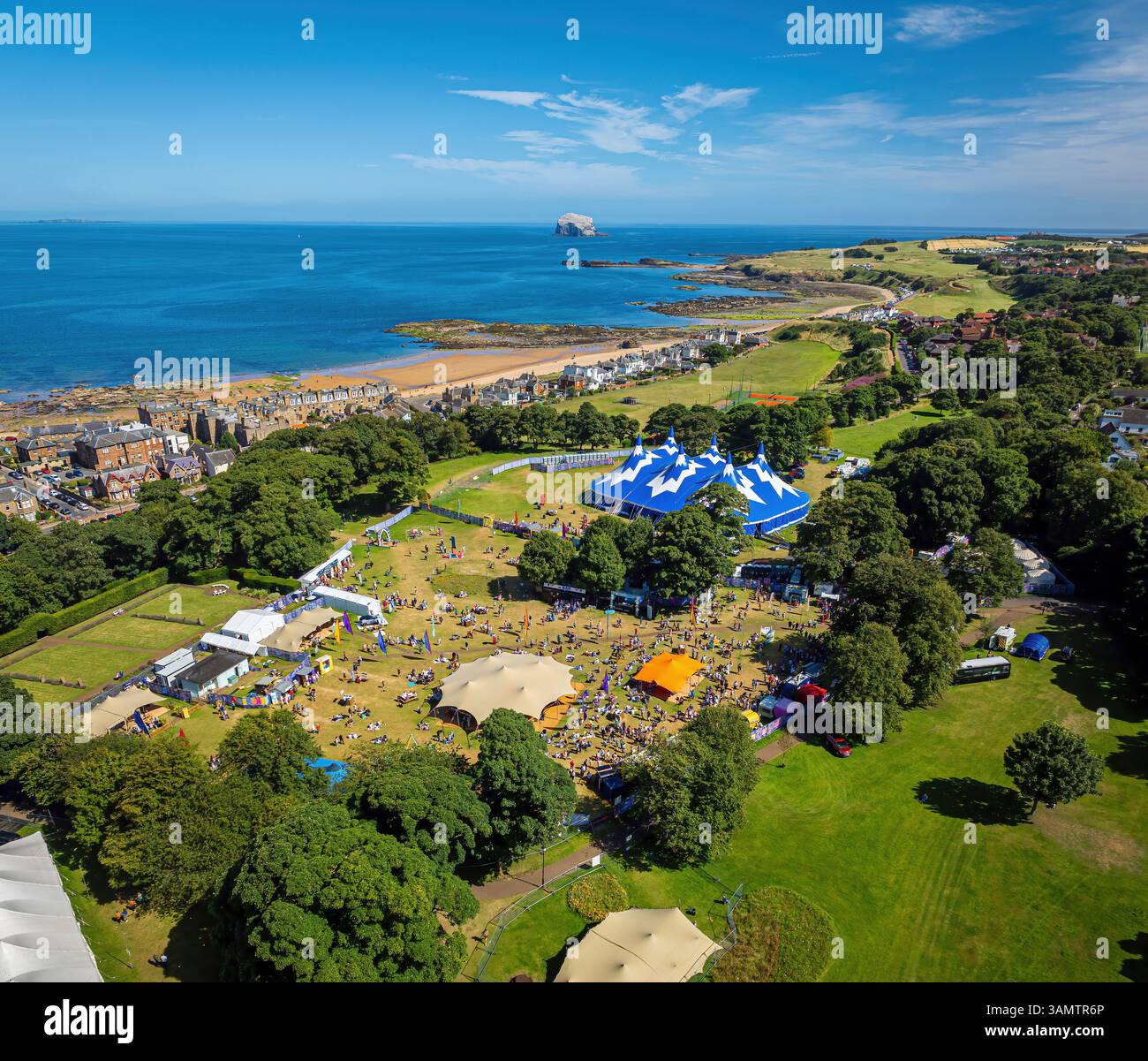 Aerial View Of The Fringe By The Sea Festival With Tents And A Crowd On aerial-view-of-the-fringe-by-the-sea-festival-with-tents-and-a-crowd-on