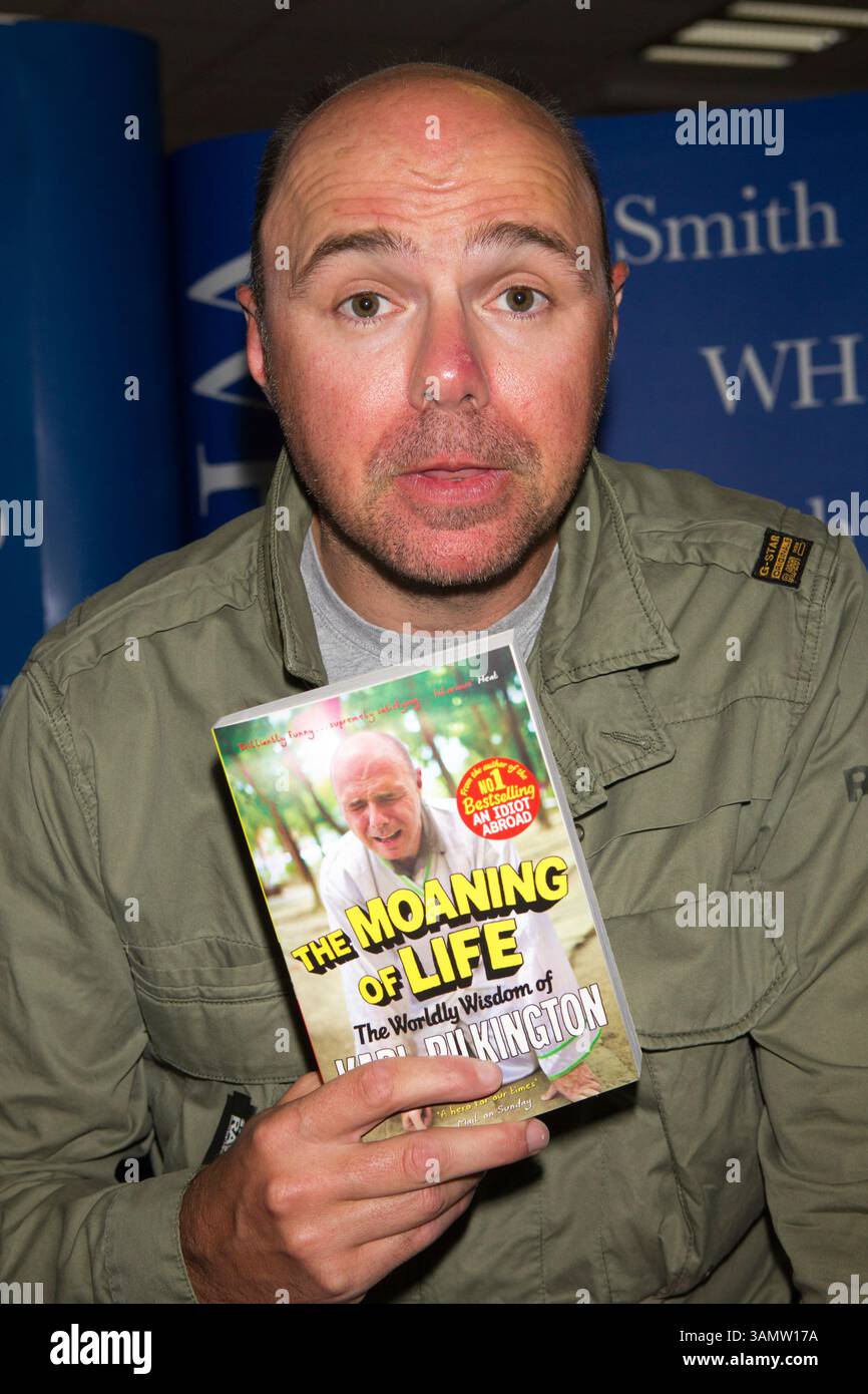Karl Pilkington signs his book 