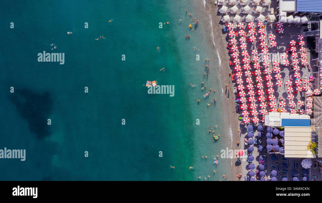 Aerial view of a crowded beach in Amalfi along the Amalfi Coast ...
