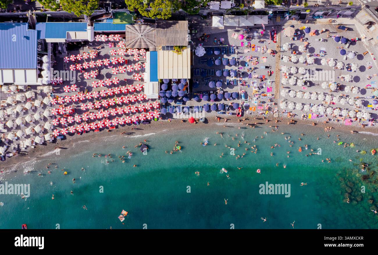 Aerial view of a crowded beach in Amalfi along the Amalfi Coast ...