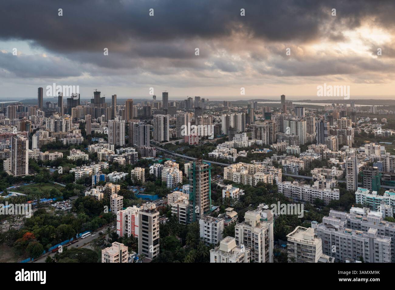 Aerial view of modern city center with dense skyscrapers and cloudy sky ...