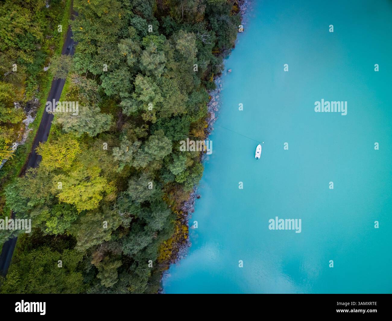 Aerial view of small boat anchored at calm river near the coast, Norway ...