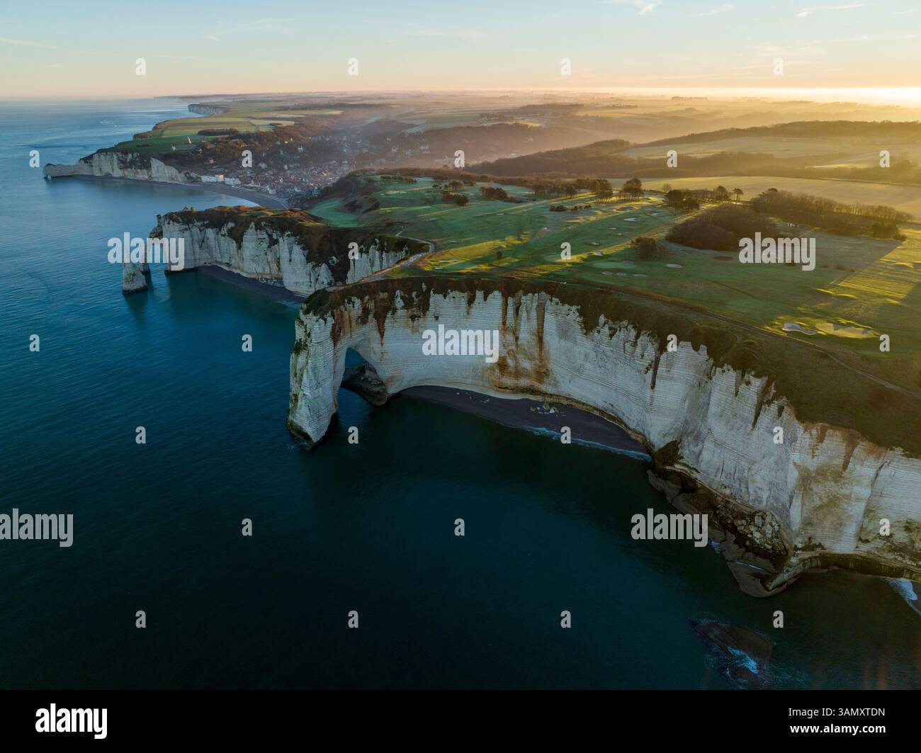 Aerial view of Etretat city behind the cliff on sunrise, Sein-Maritime ...