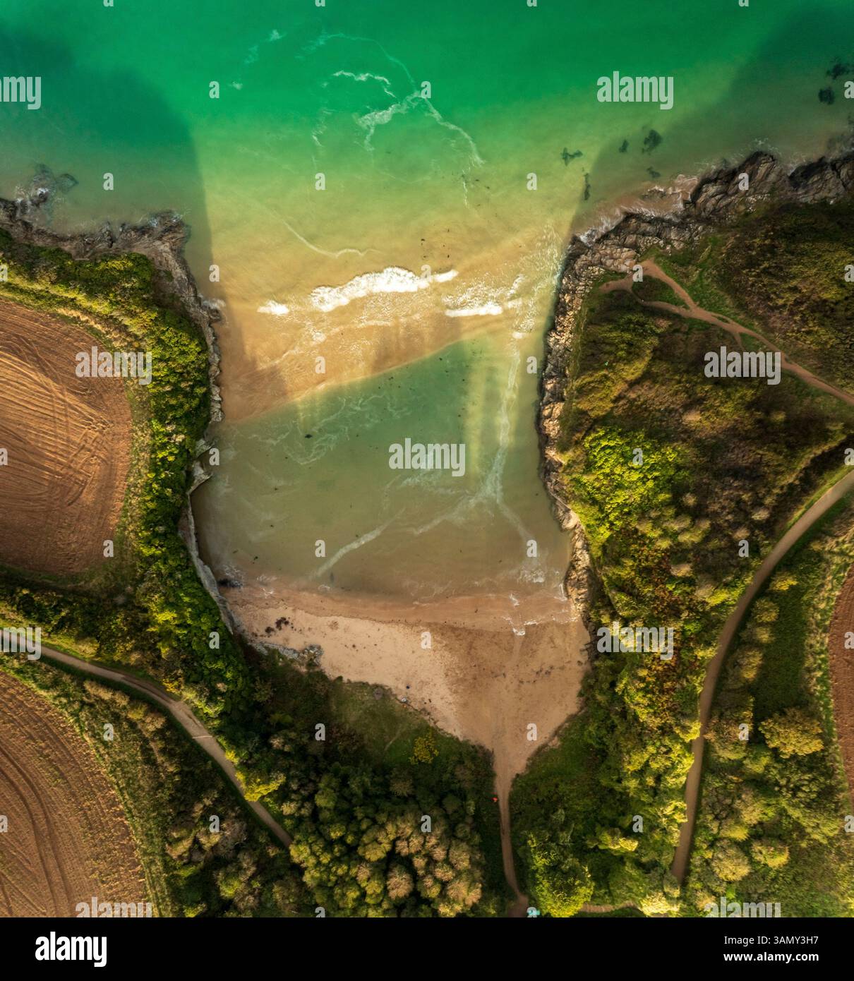 aerial-topdown-view-of-st-georges-cove-during-sunset-padstow-cornwall