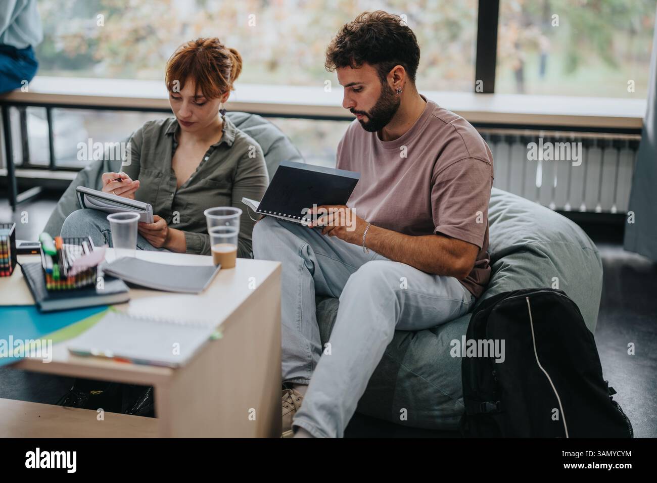 Students collaborating on academic project in a modern study space Stock Photo