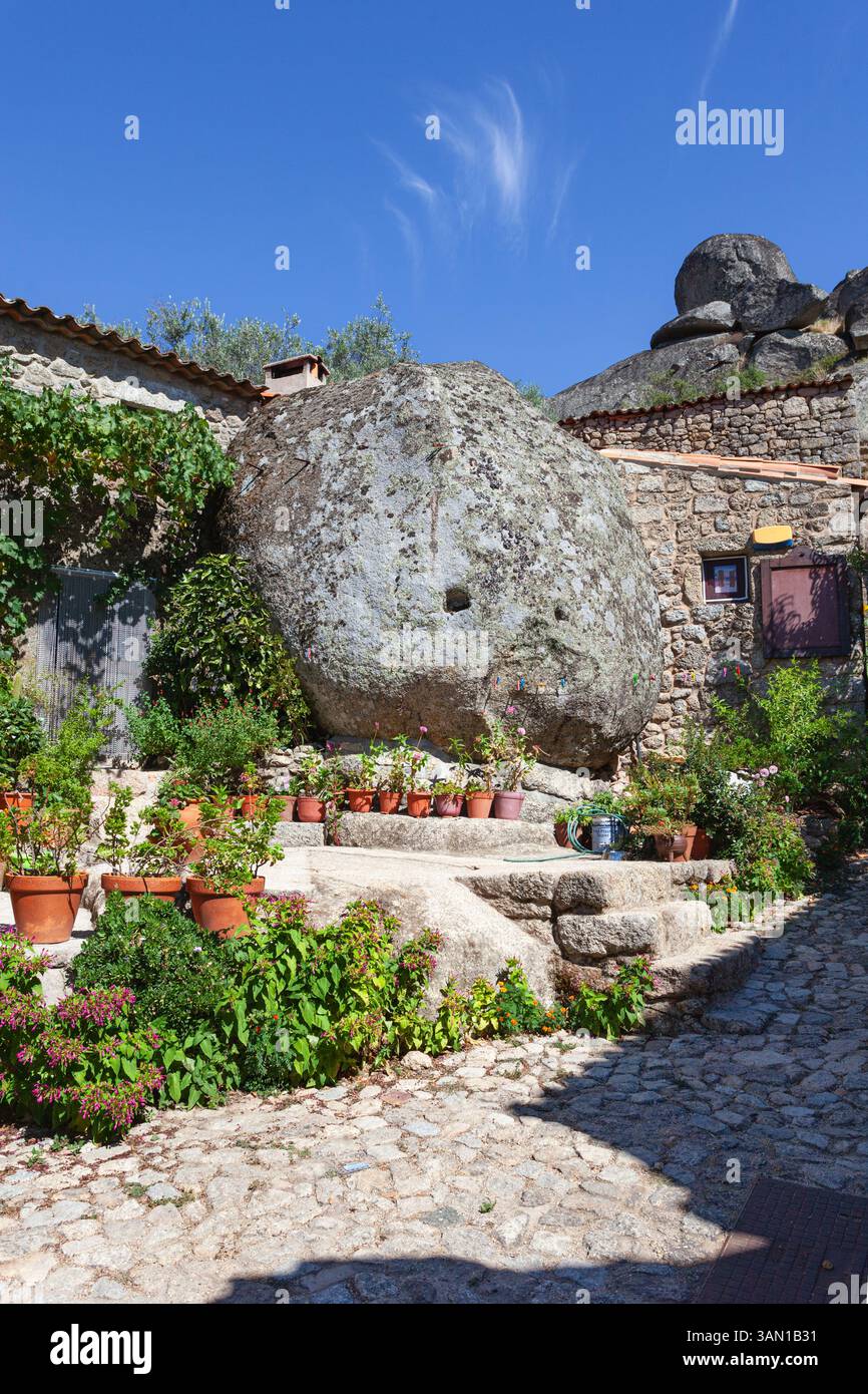 A granite house built around a giant boulder in the historical and unique hilltop village of Monsanto, located in the district of Castelo Branco. Stock Photo