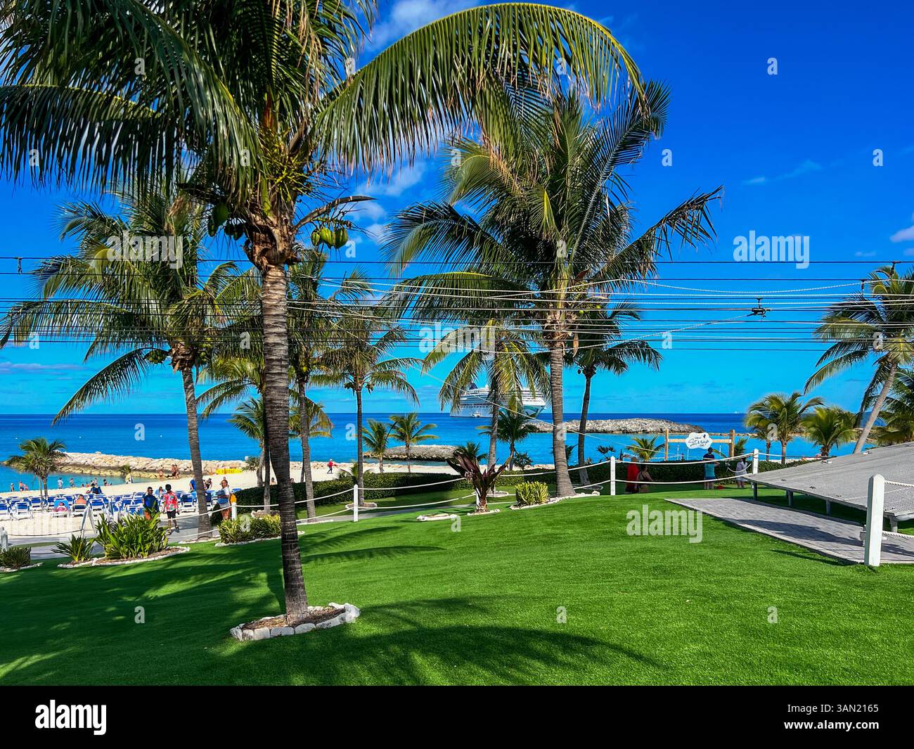 Ziplining with a view of turquoise waters and palm trees is the perfect way to enjoy this tropical paradise. - Smartphone Captured Stock Image