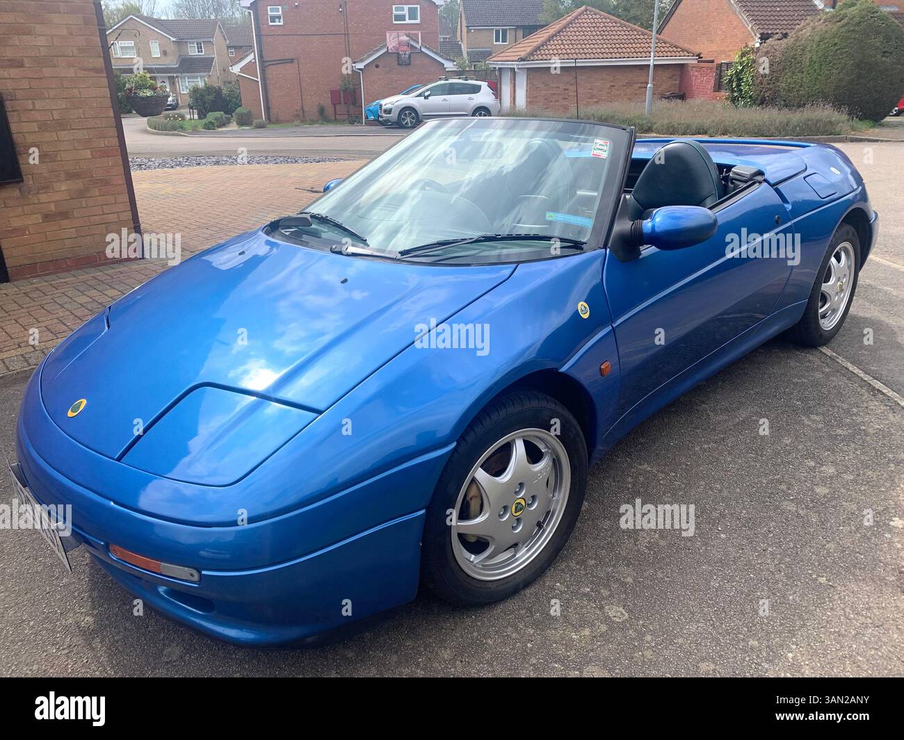 Lotus sports car Elan M100 turbo 1990 sporty fast historic history blue pacific colour soft top old vintage British English England elegant design UK - Smartphone Captured Stock Image
