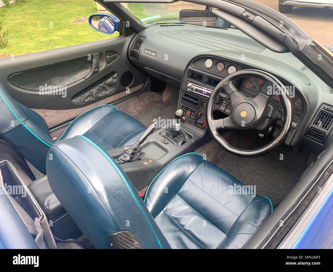 Lotus sports car Elan M100 turbo 1990 sporty fast historic history blue pacific colour soft top old vintage British English England elegant design UK - Smartphone Captured Stock Image