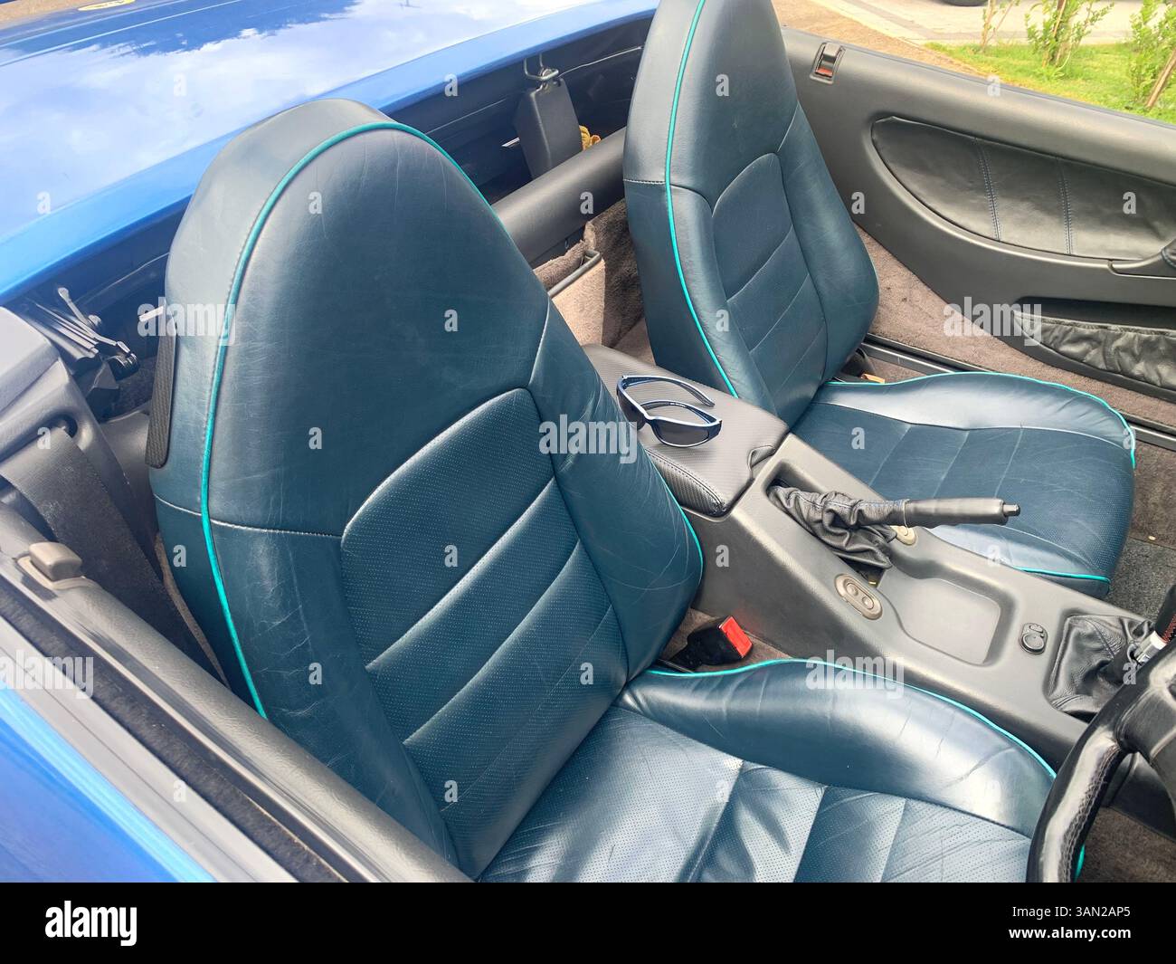 Lotus sports car Elan M100 turbo 1990 sporty fast historic history blue pacific colour soft top old vintage British English England elegant design UK - Smartphone Captured Stock Image
