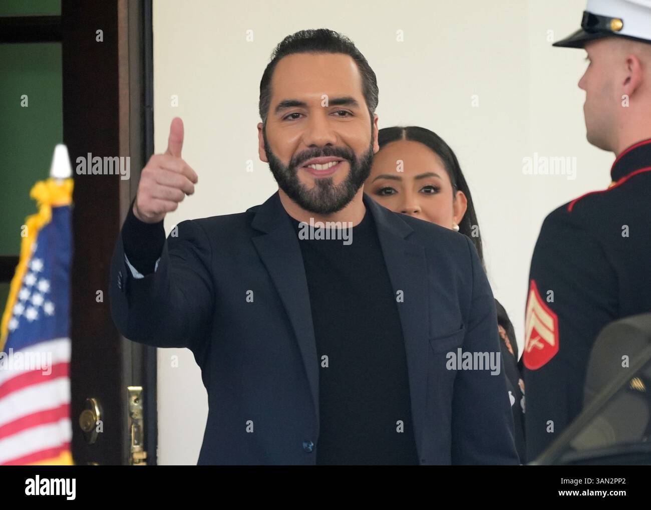 El Salvador's President Nayib Bukele gives a thumbs up as he departs ...