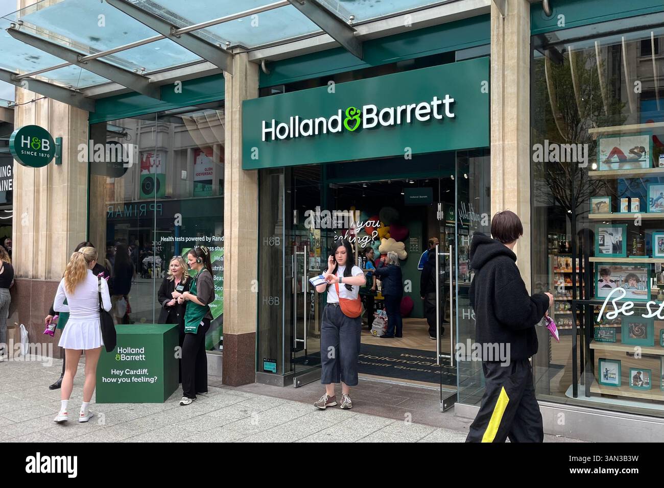 Holland & Barrett Storefront on Queen Street. Cardiff, Wales, United Kingdom. 12th April 2025. - Smartphone Captured Stock Image