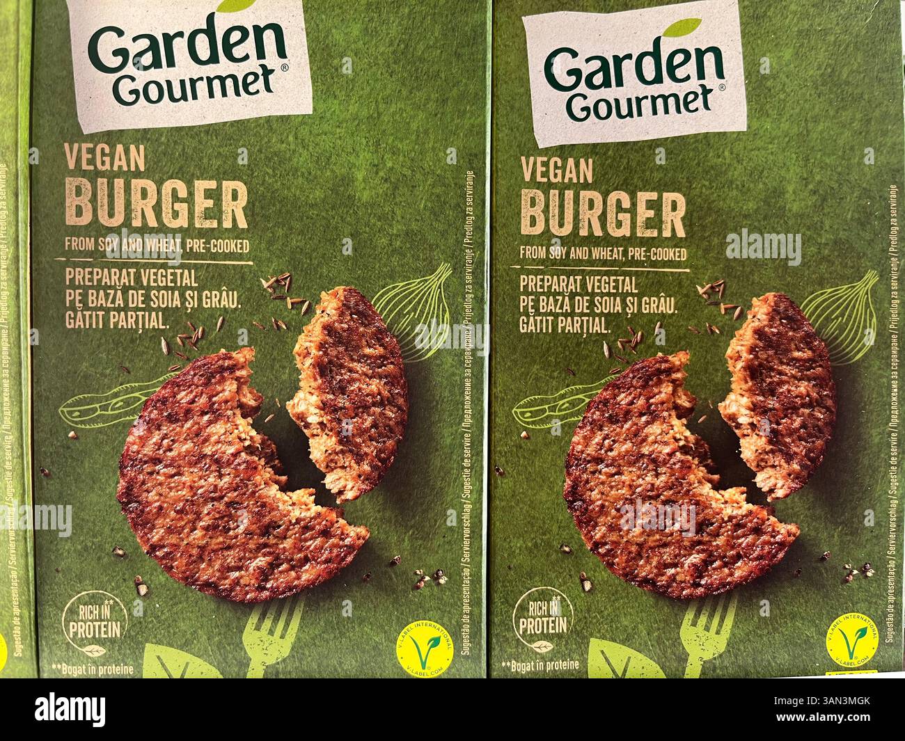 Pack of Garden Gourmet vegan burgers in the grocery freezer, offering a delicious, plant-based frozen meal option for vegan diets. - Smartphone Captured Stock Image