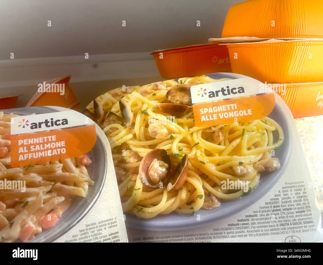 Packs of ready-to-eat frozen spaghetti and penne by Artica in supermarket freezer, convenient meal, quick meals, frozen pasta, frozen meal - Smartphone Captured Stock Image