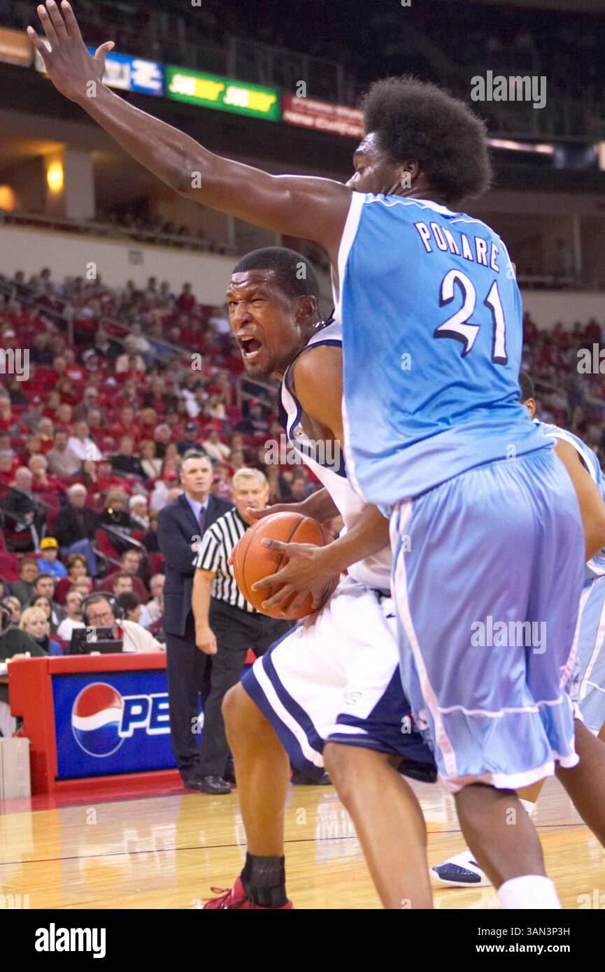 Fresno State junior forward Dominic McQuire positions for a shot against San Diego Terero sophomore forward Gyno Pomare (#21) in action against the San Diego Tereros at the Save Mart Center in Fresno, CA on December 30, 2006.  Fresno State won a close game 68 to 65.(Credit Image: © Phil Hawkins/Cal Sport Media) Stock Photo