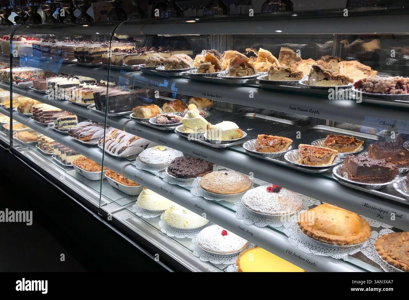 Different types of cakes and pastries in a bakery shop window Stock ...