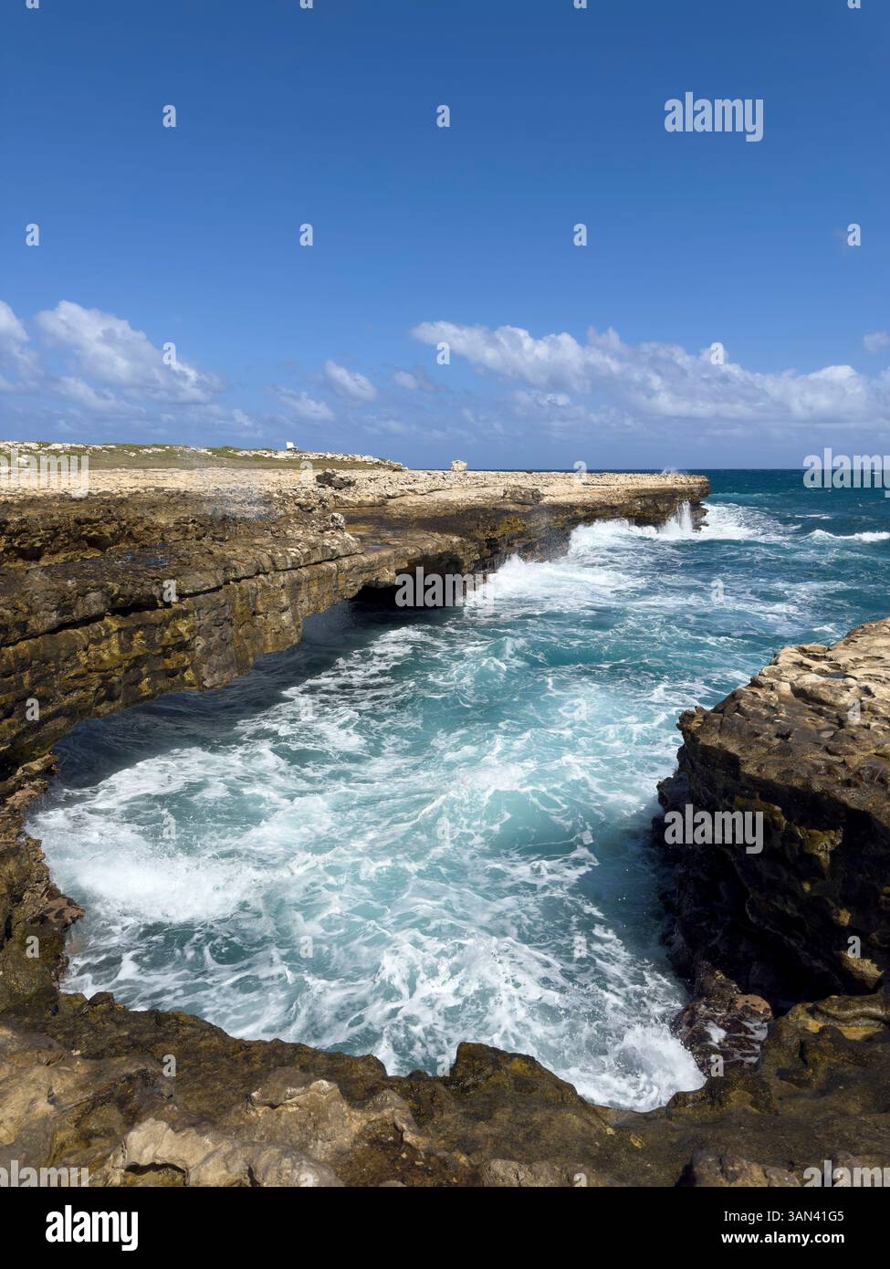 Waves hitting the coast at Devils Bridge, Antigua, Caribbean - Smartphone Captured Stock Image