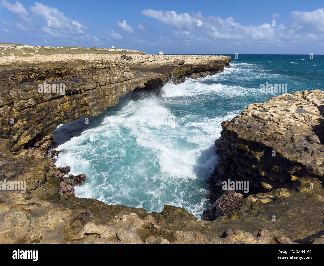 Waves hitting the coast at Devils Bridge, Antigua, Caribbean - Smartphone Captured Stock Image