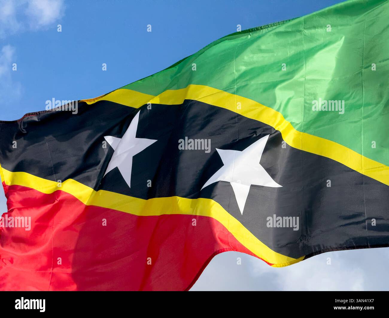 Close up of flag of St Kitts and Nevis flying on a sunny day - Smartphone Captured Stock Image