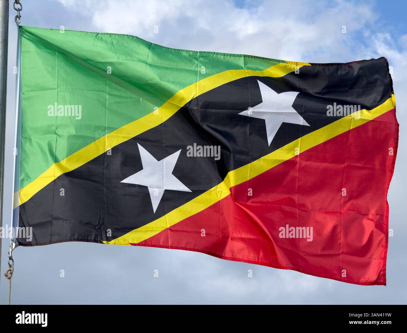 Flag of St Kitts and Nevis flying on a sunny day - Smartphone Captured Stock Image