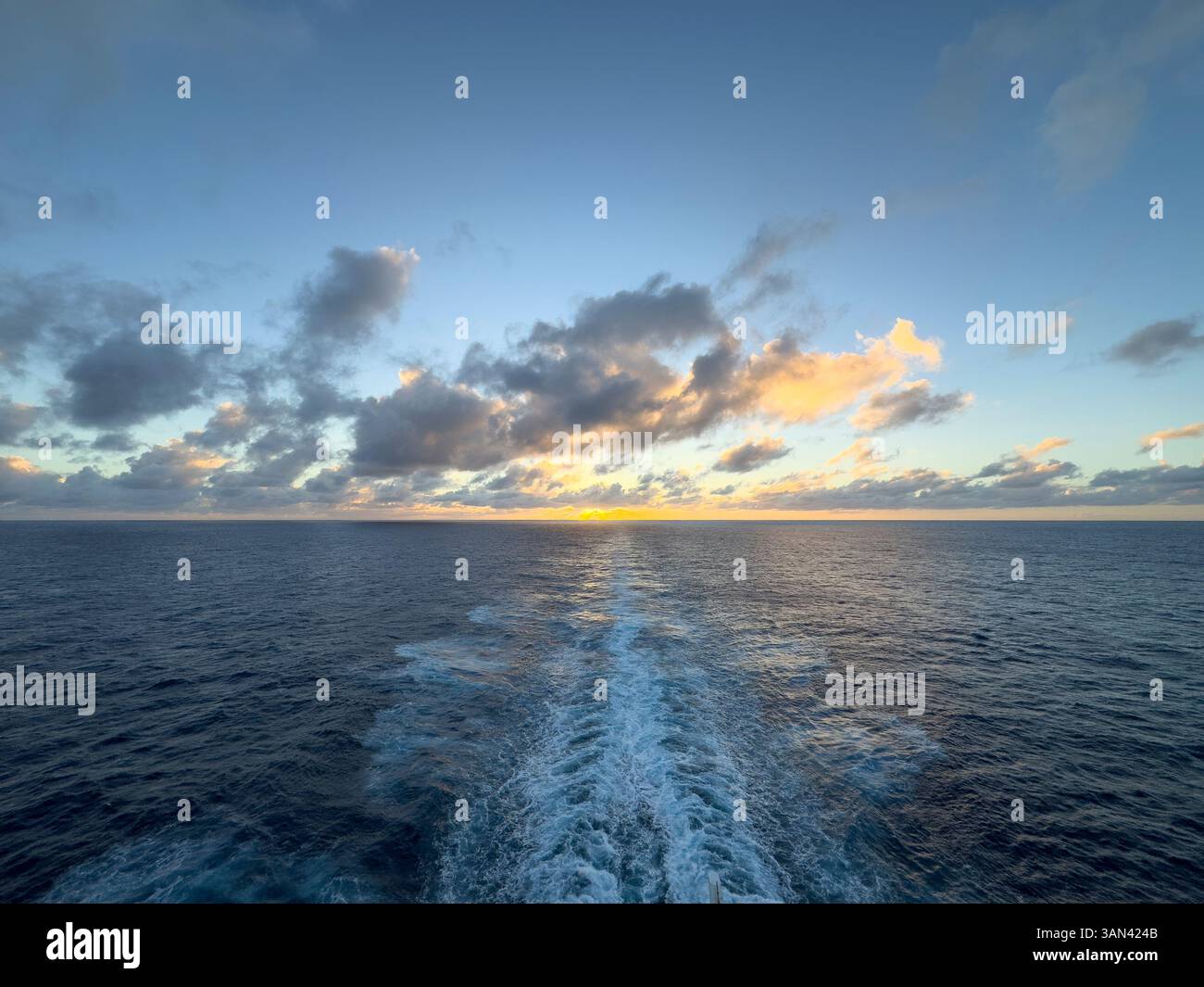 Wake of a cruise ship at sunset in the Caribbean Stock Photo - Alamy