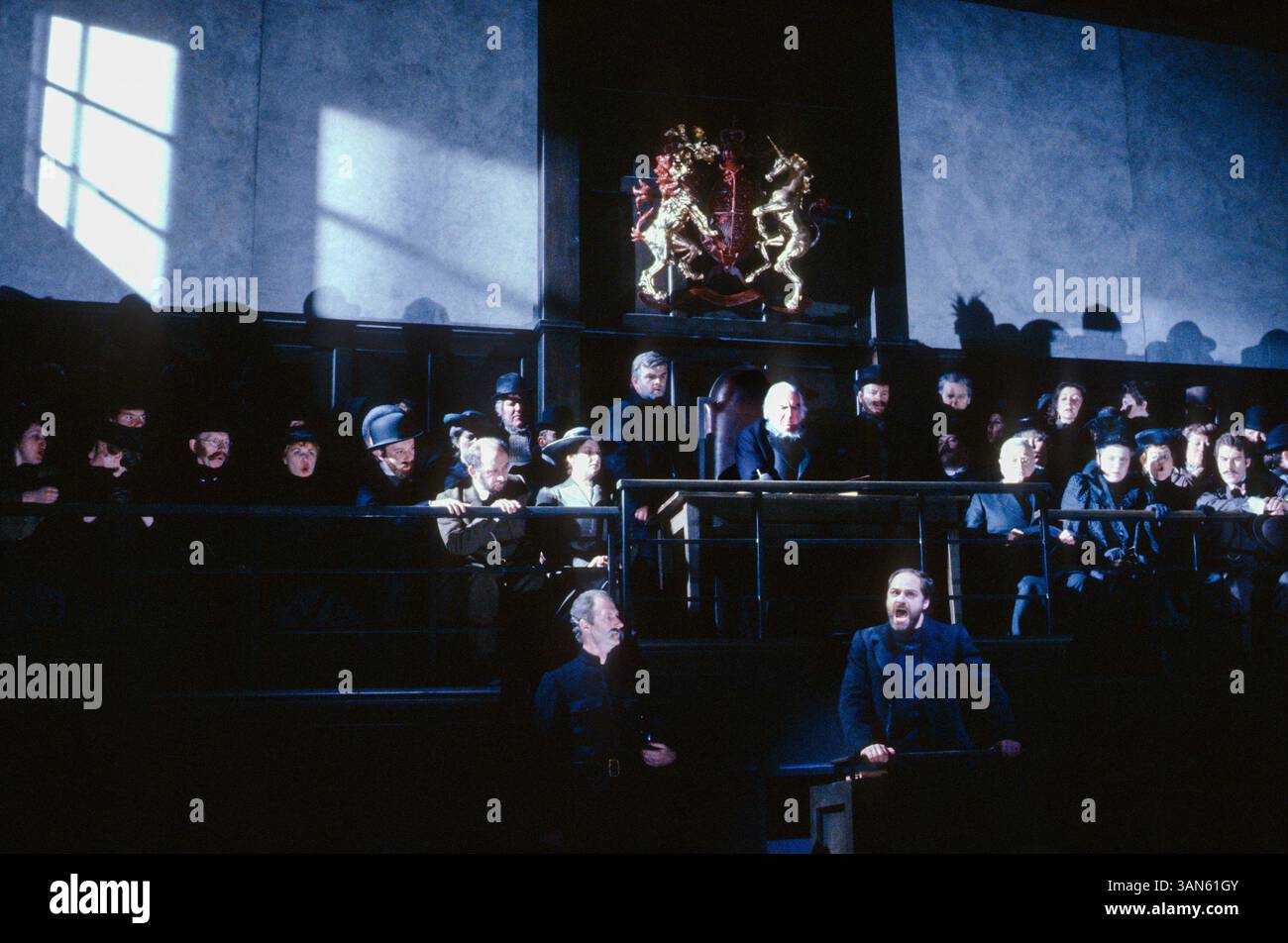 the apprentice's inquest - centre: Donald Adams (Swallow)  bottom right: Stephan Drakulich (Peter Grimes) in PETER GRIMES at Glyndebourne Festival Opera, East Sussex, England  02/05/1992 music: Benjamin Britten  libretto: Montagu Slater  conductor: Andrew Davis  design: John Gunter  lighting: Pat Collins  director: Trevor Nunn Stock Photo