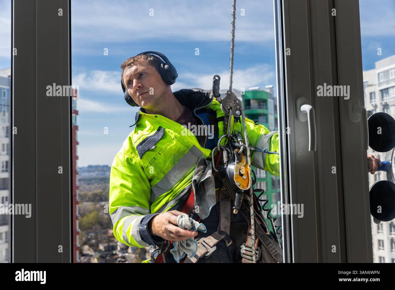 Skilled Window Cleaner Working on High-Rise Building, Captured in ...