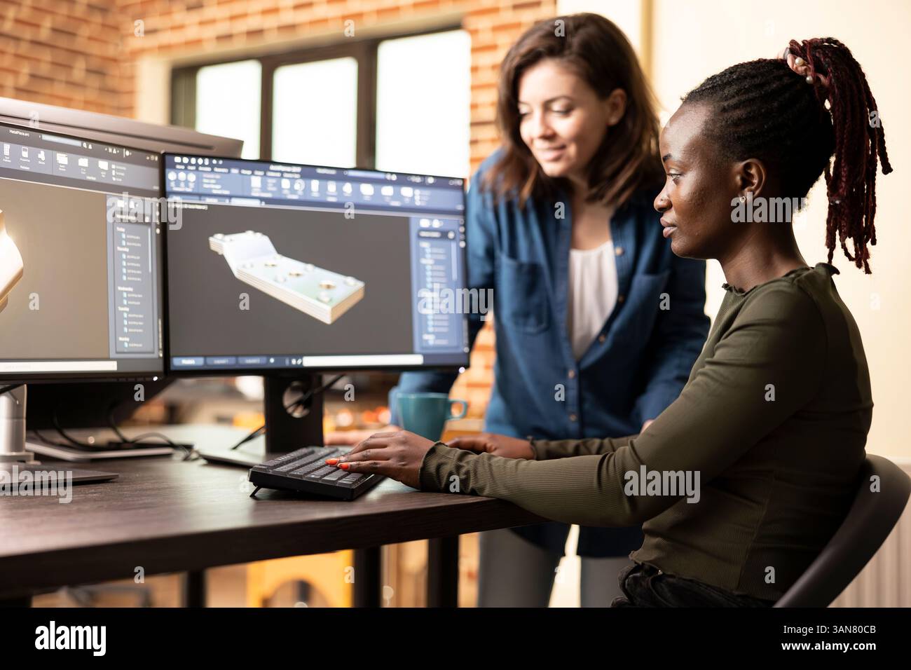African american artist discussing geometry error with coworker, working together in fixing technical problem. Caucasian team leader identifying a mesh issue and guiding a colleague on the solution. Stock Photo