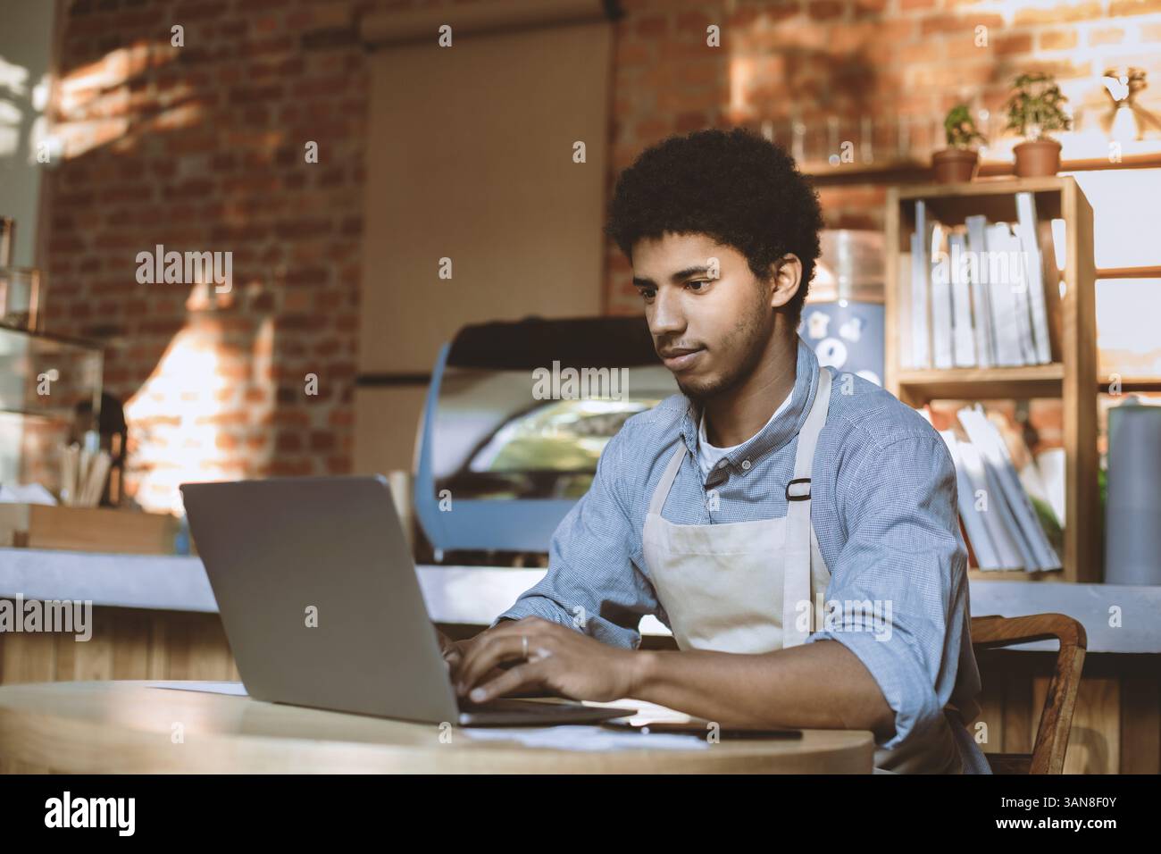 Man owner working and checking email on computer Stock Photo