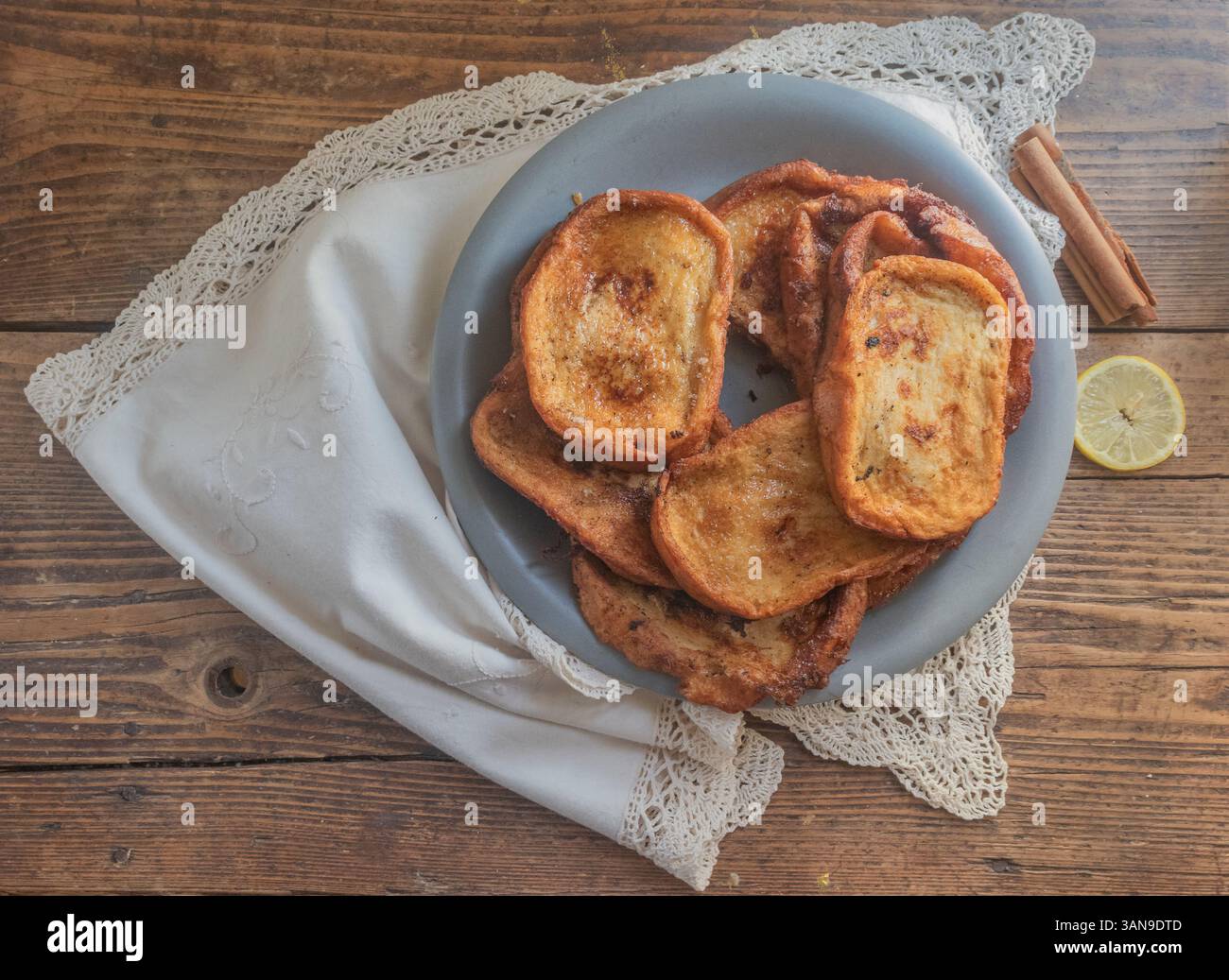 Traditional Spanish Torrijas on a rustic table. Stock Photo
