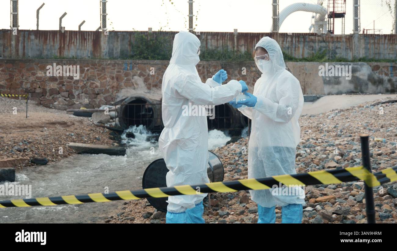 Ecologist sampling water from the river with test tube Stock Photo - Alamy