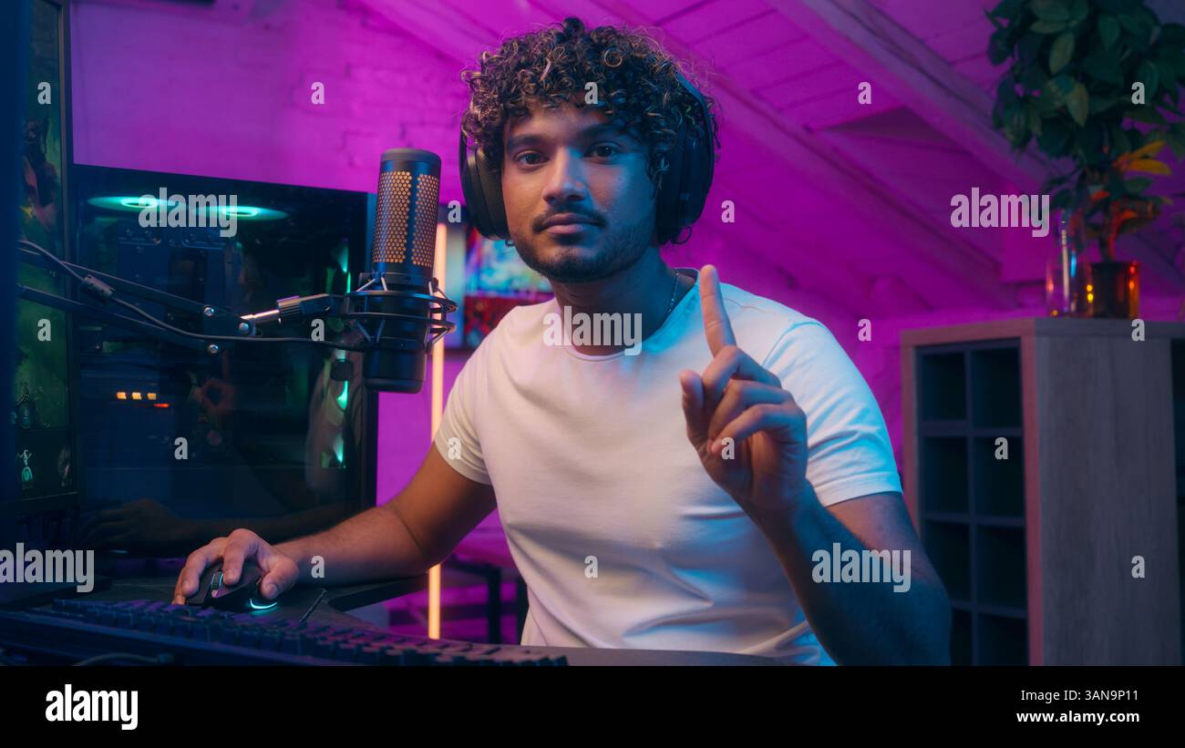 Excited Indian Arabian Latino man shaking finger no influencer playing ...