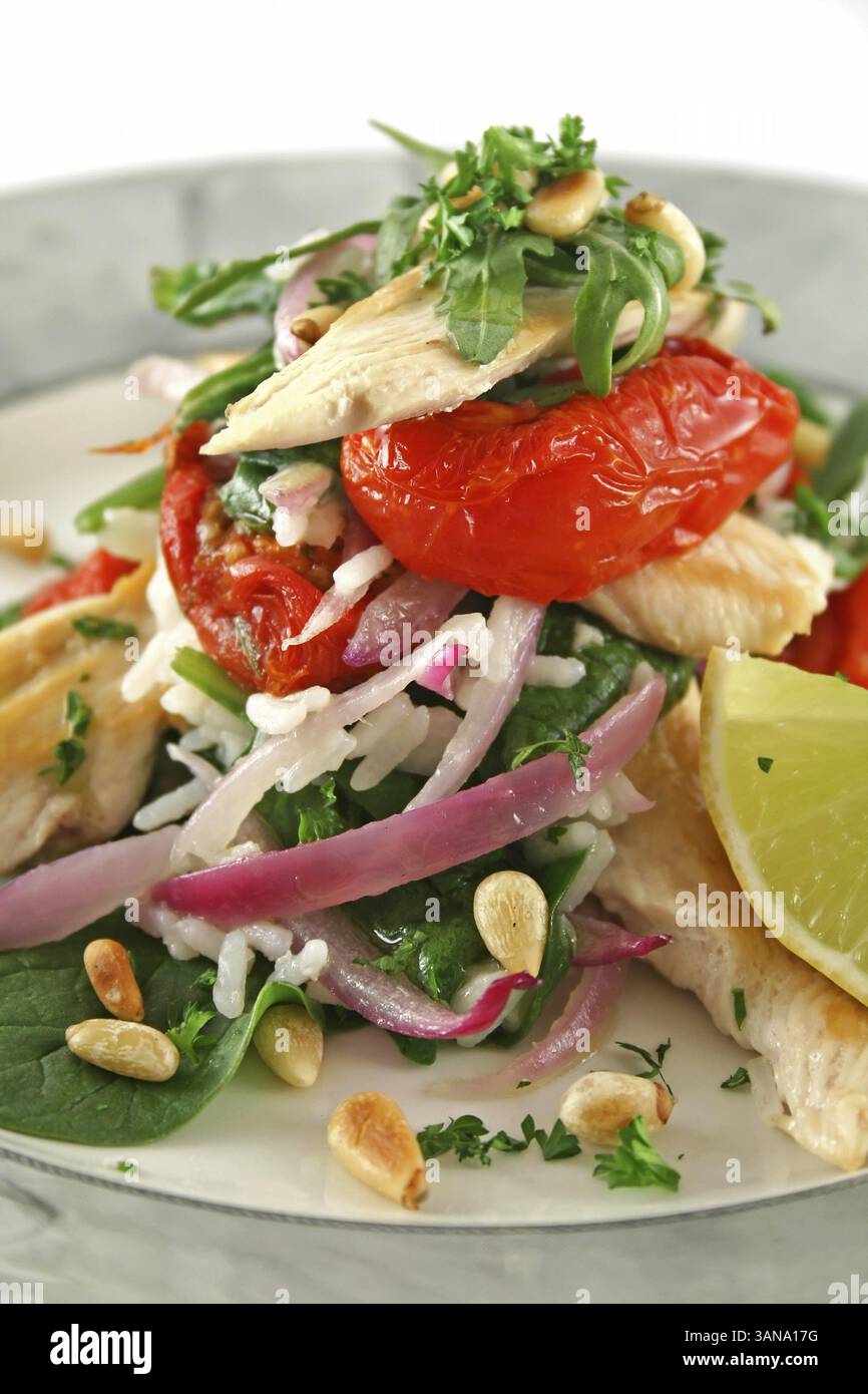 Chicken and pine nut stack with sundried tomatoes, baby spinach and ...