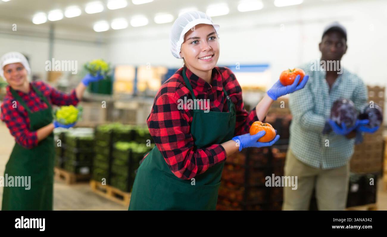 Vegetable warehouse workers preforming dance in workplace Stock Photo ...