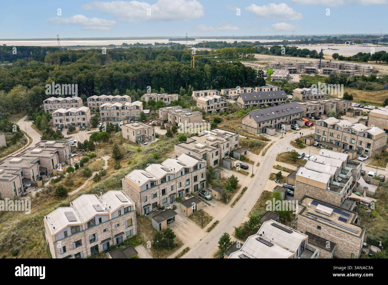 This image showcases a sprawling urban development with various ...