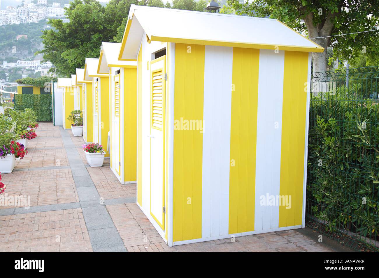 Striped yellow and white beach huts Stock Photo