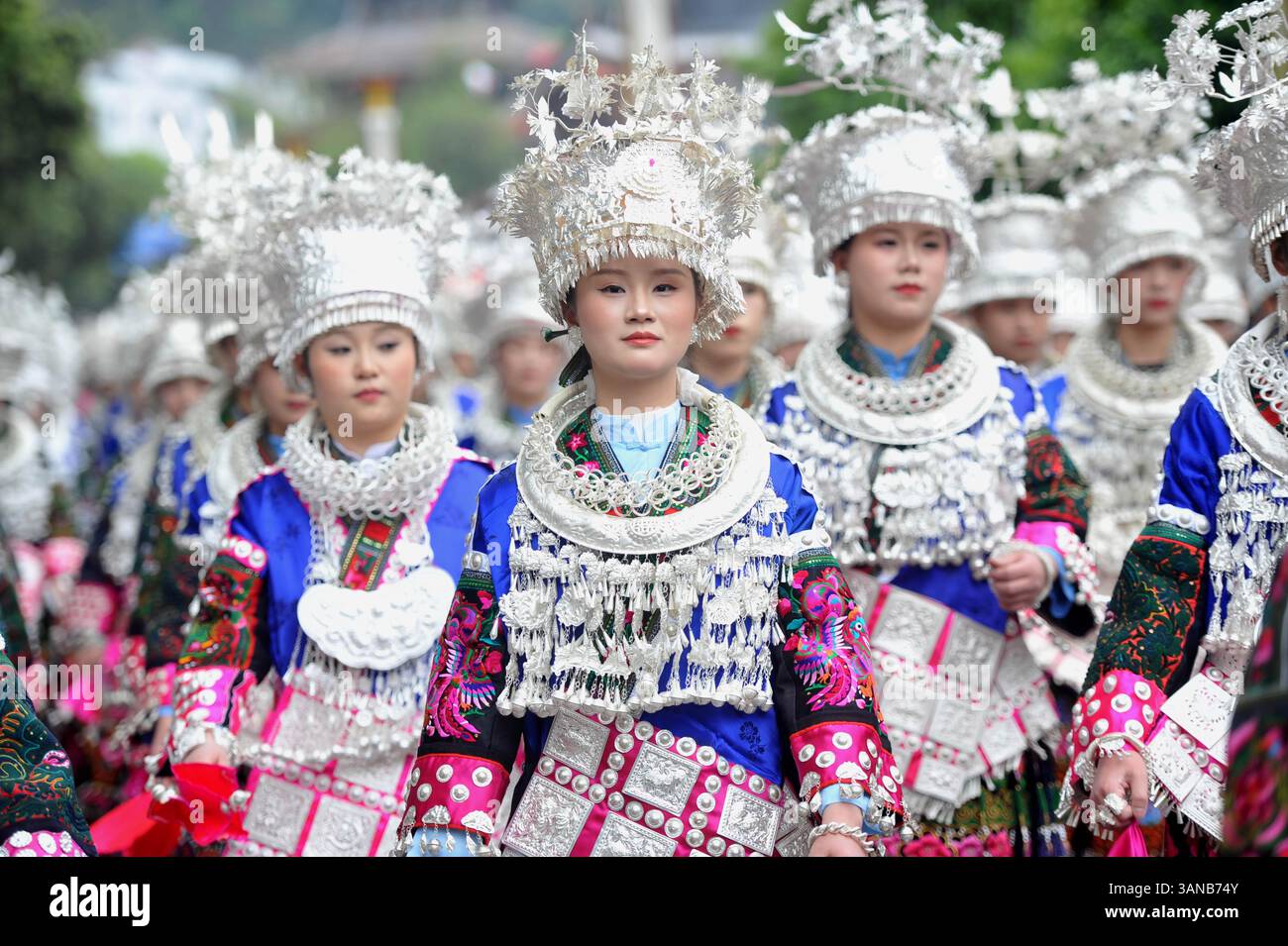 People of Miao ethnic group attend a parade to celebrate the Miao ...