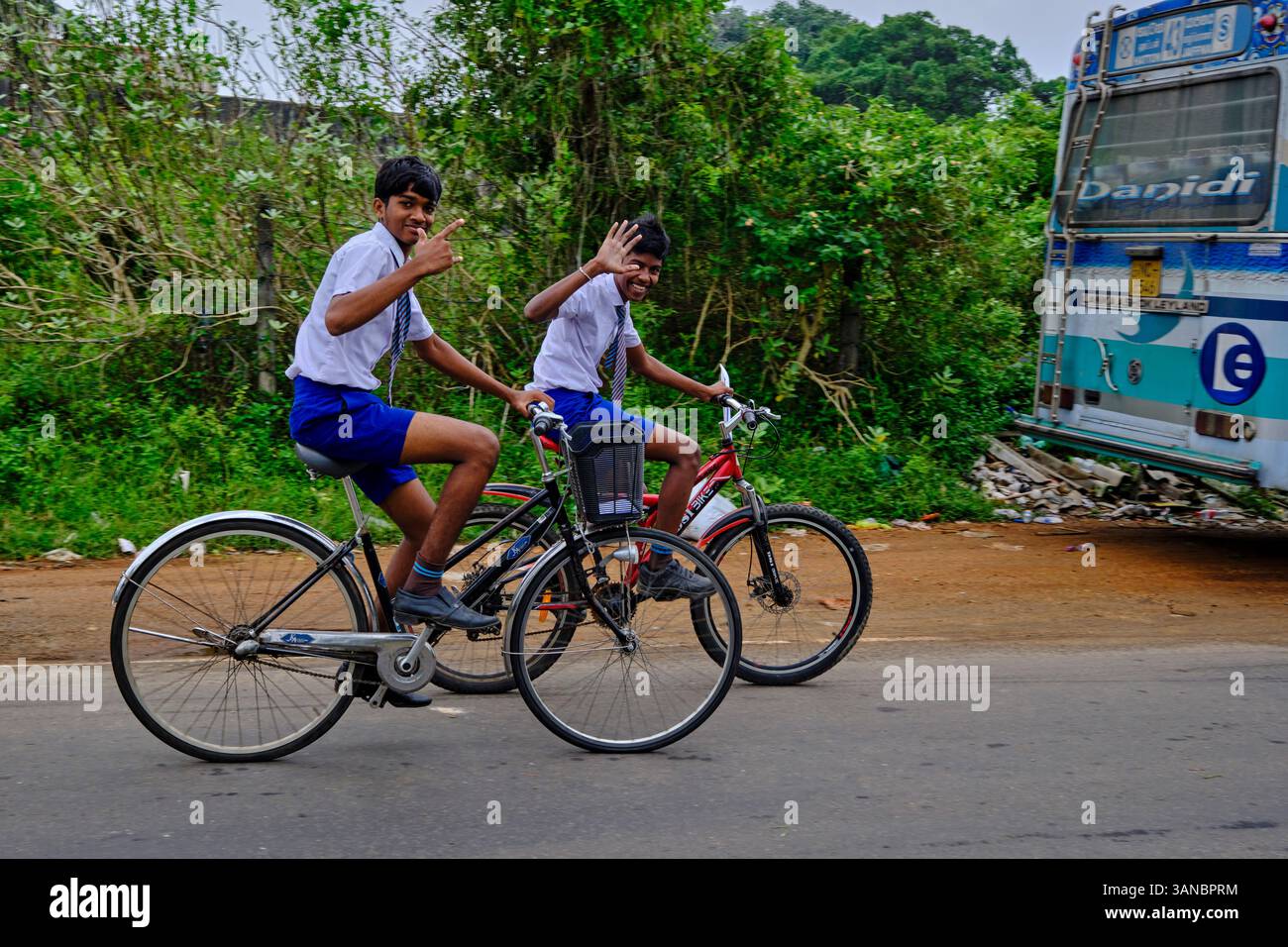 Sri Lanka, Northern Province, Jaffna, Catholic fishing district, students on bicycles Stock Photo