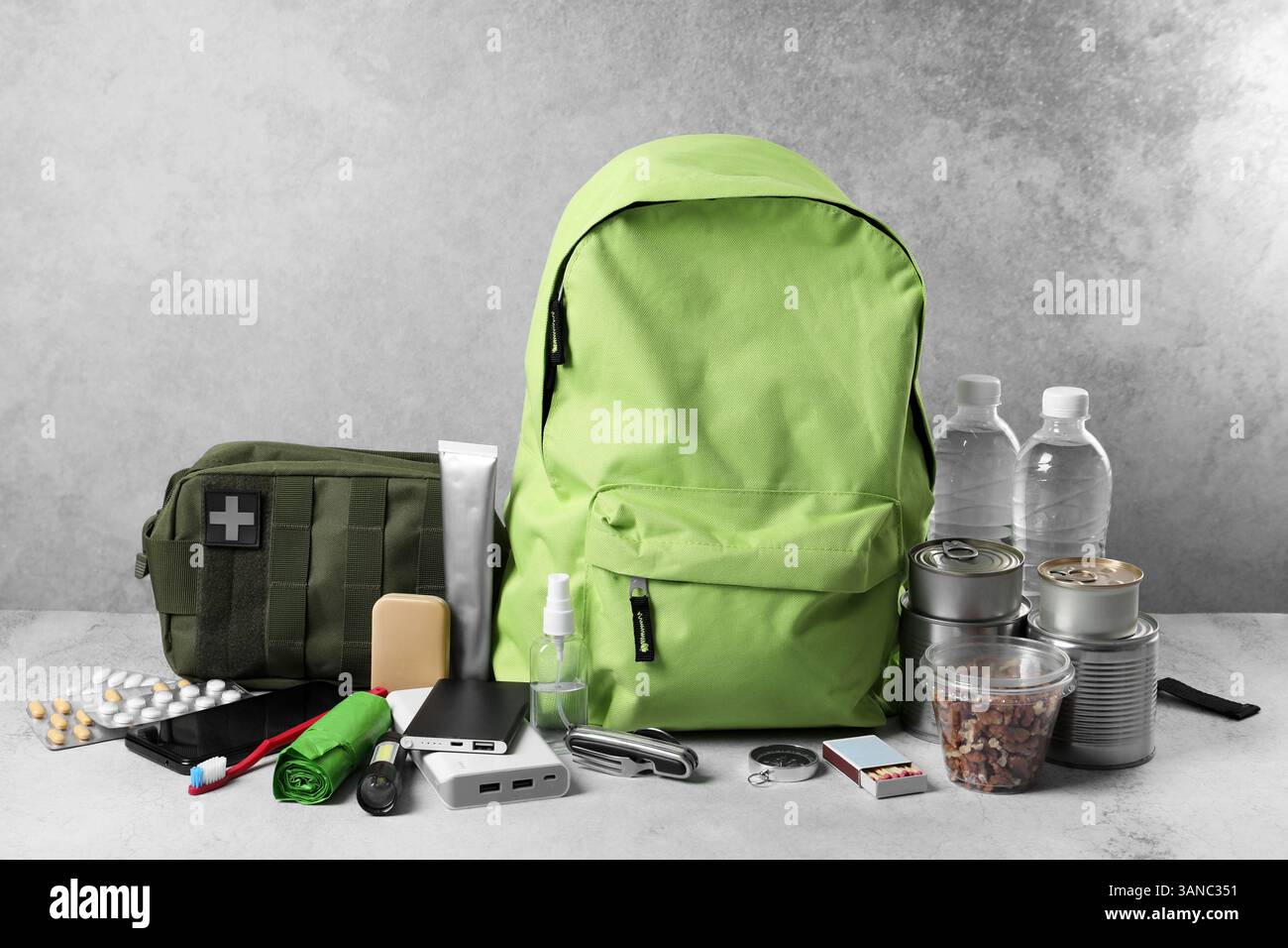 Survival kit. Different emergency supplies on light table Stock Photo