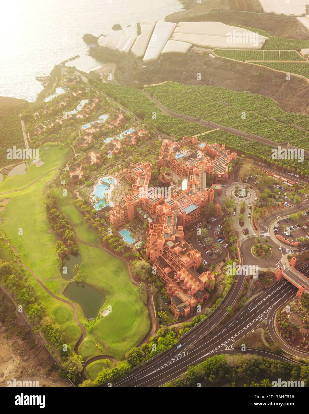 Aerial view of Abama Garden Resort surrounded by ocean and lush greenery, Guia de Isora, Spain. Stock Photo