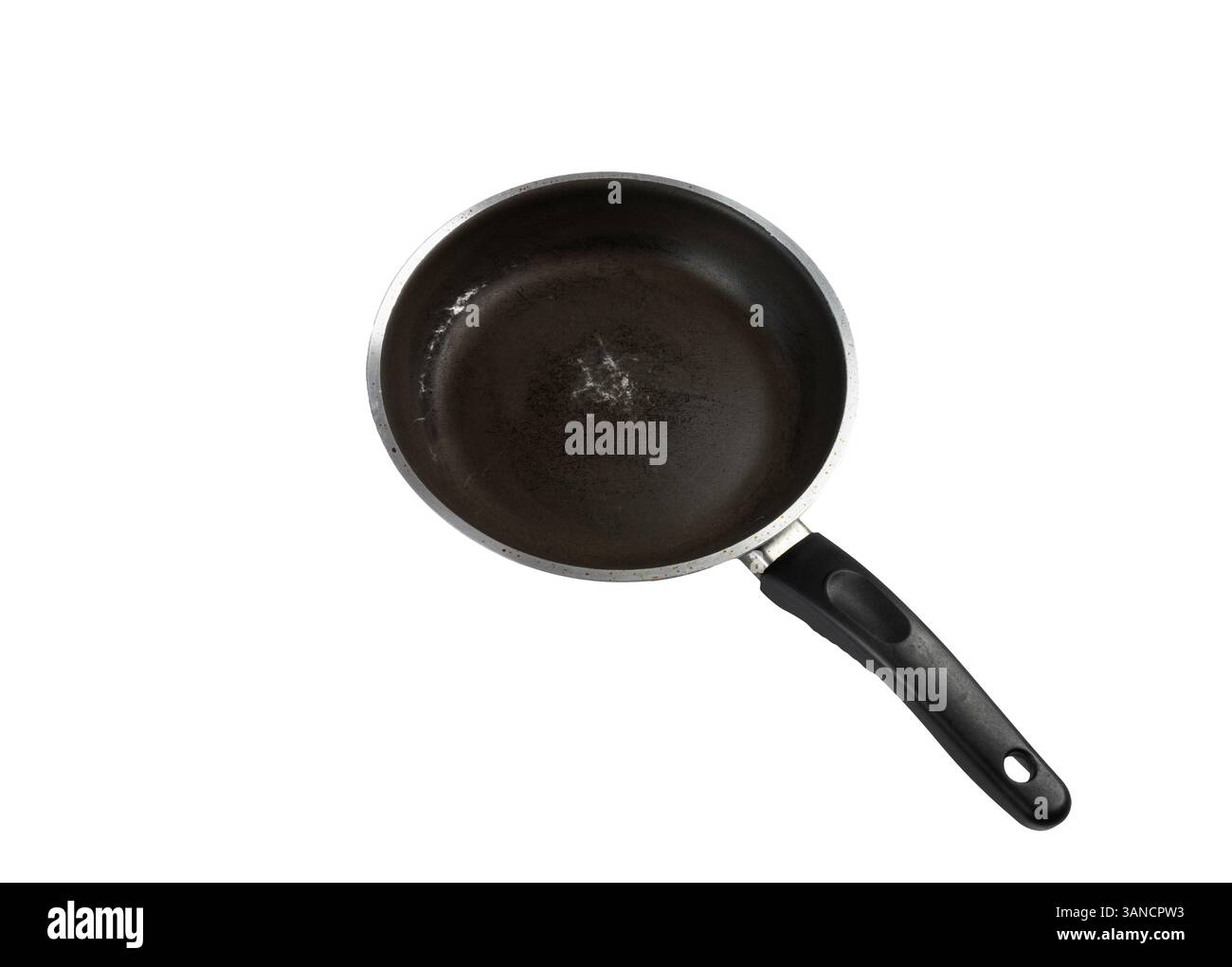 an old scratched pan on a transparent surface Stock Photo