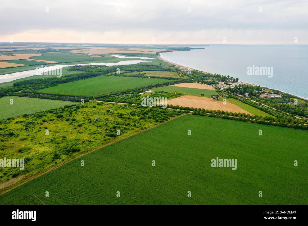 Aerial view of beautiful Shablenska Tuzla with expansive fields and ...